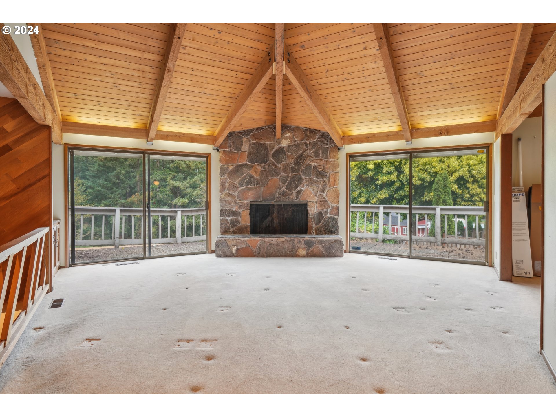 12795 Southeast Callahan Road Happy Valley, OR 97086 - Photo 7 of 42 a view of an empty room with a fireplace