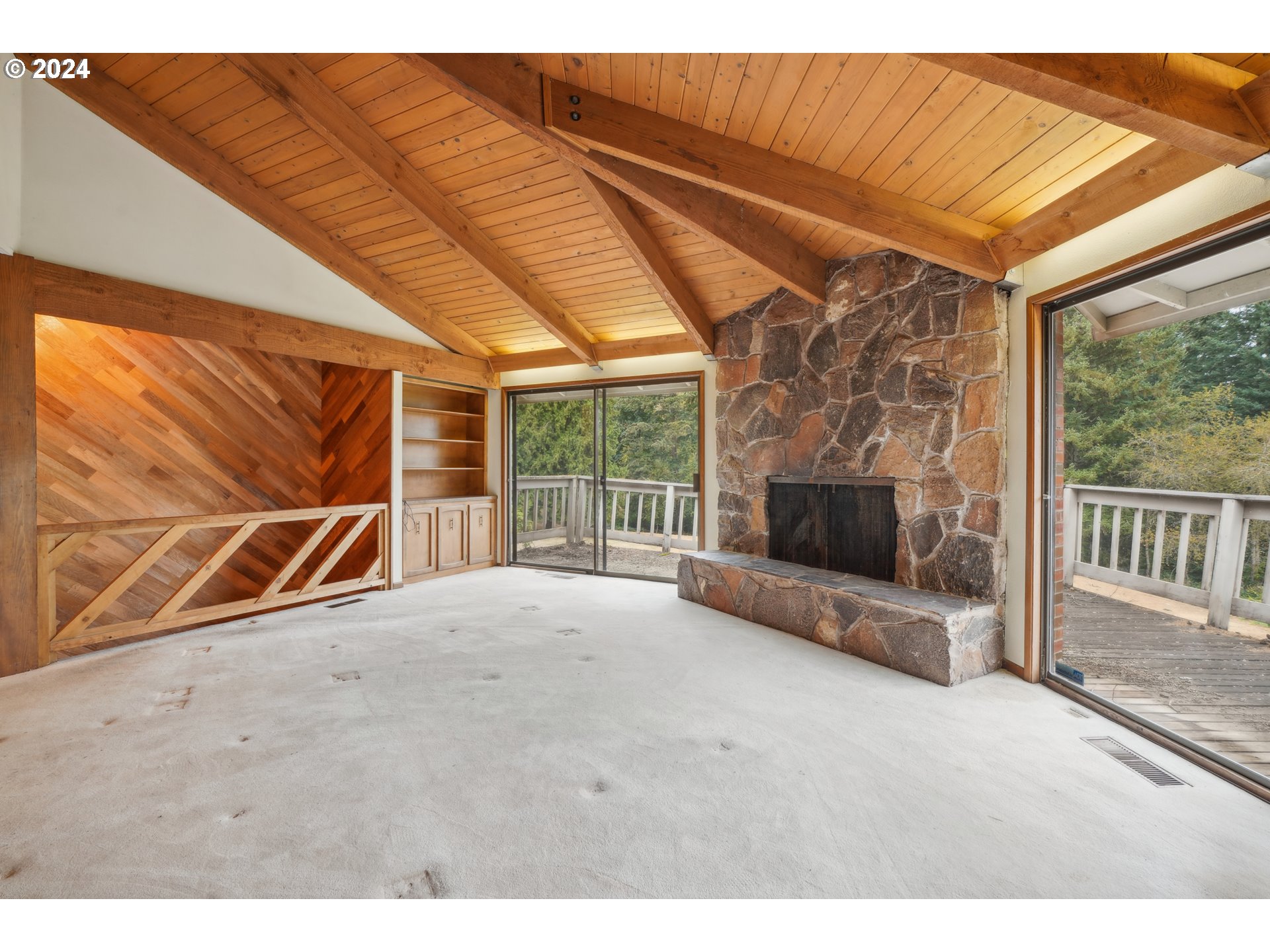 12795 Southeast Callahan Road Happy Valley, OR 97086 - Photo 8 of 42 a view of an empty room with a fireplace