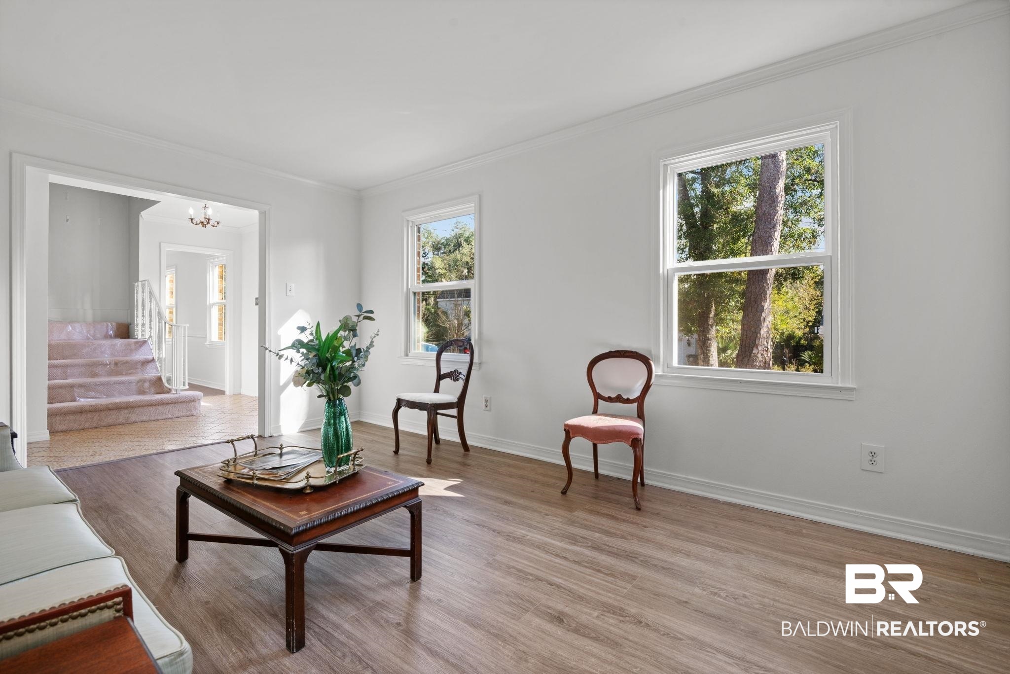 511 Wacker Lane North Mobile, AL 36608 - Photo 14 of 45 Living room with crown molding, light wood-type flooring, a chandelier, and stairs
