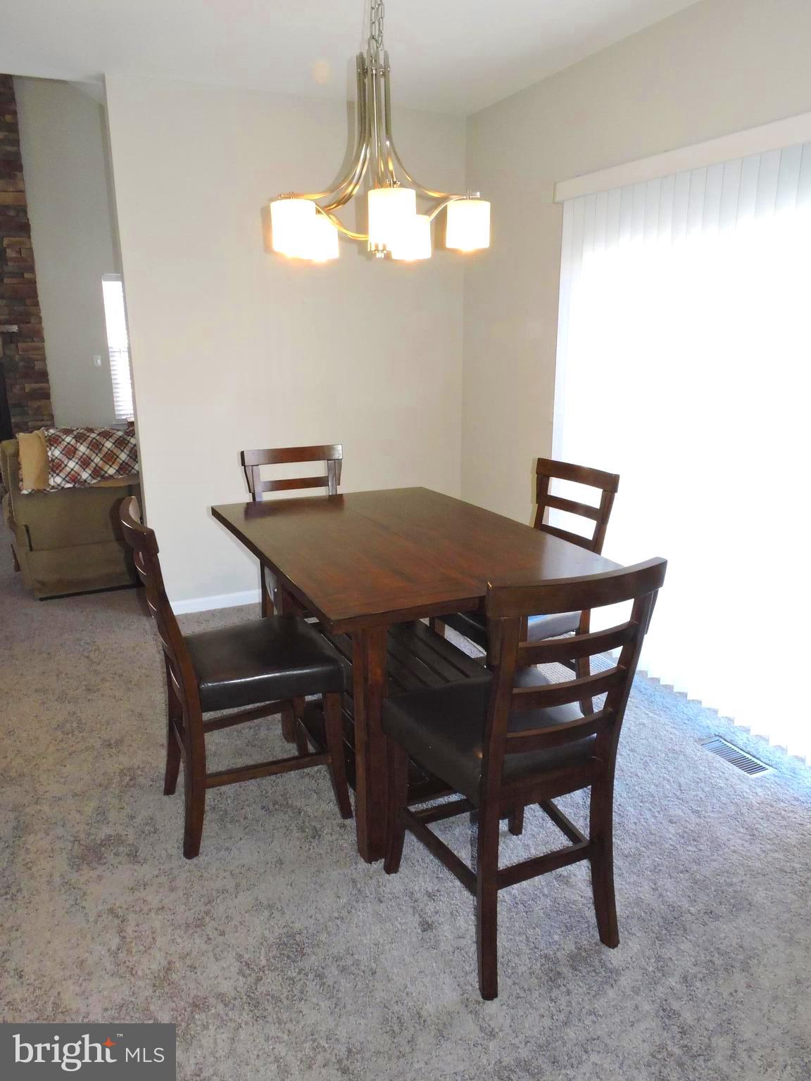 42 Watercourse Drive Ranson, WV 25438 - Photo 8 of 37 New carpet in dining room w/ access to patio