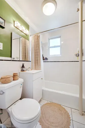 a bathroom with a toilet a sink and a bathtub