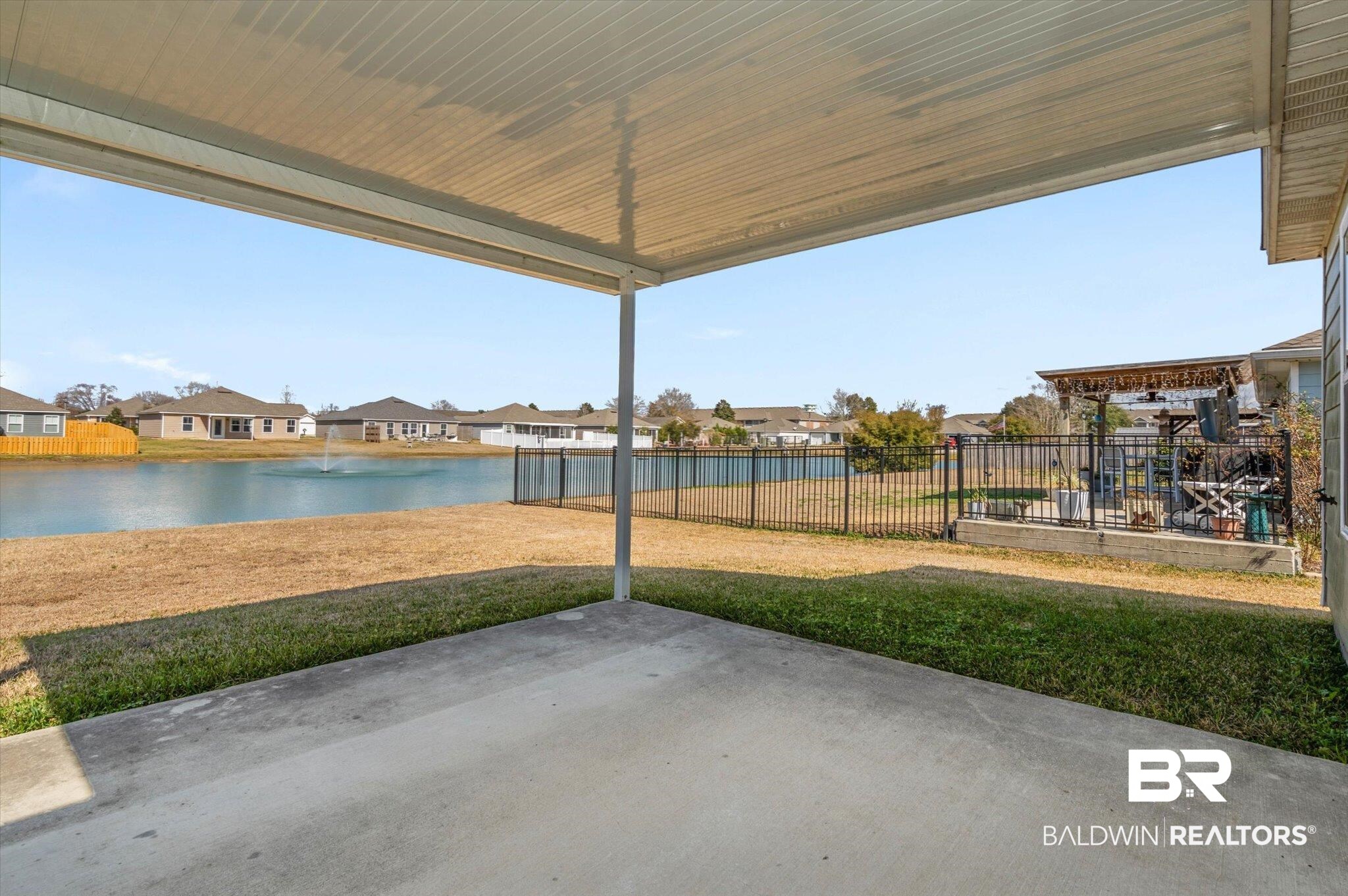 919 Sailor Circle Foley, AL 36535 - Photo 20 of 24 View of patio / terrace featuring a residential view and a water view