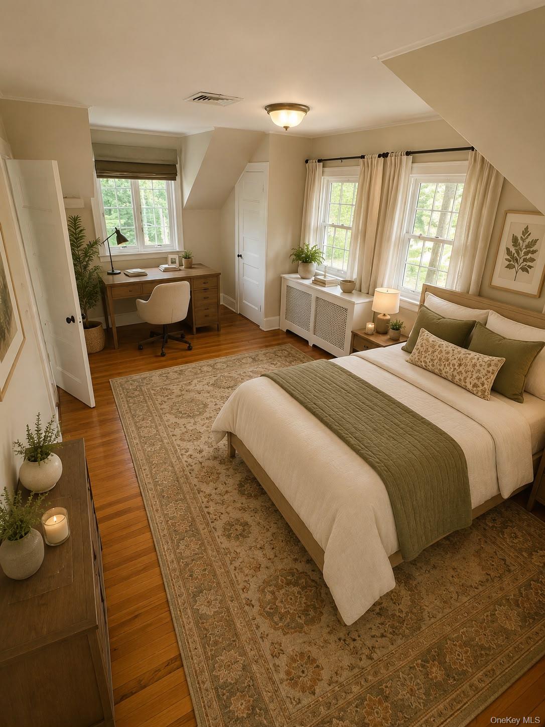 6 Tower Road Glen Cove, NY 11542 - Photo 7 of 12 a spacious bedroom with a bed and wooden floor