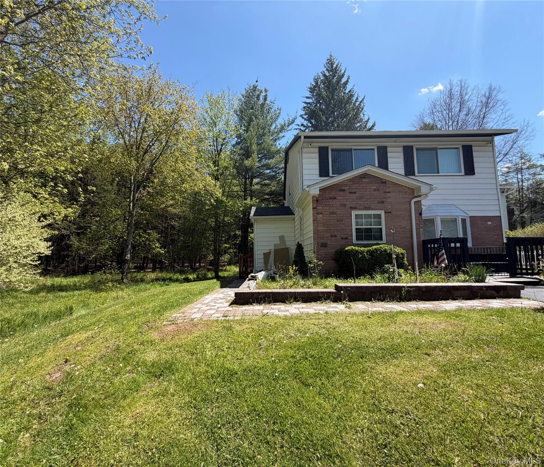 60 Medallion Road Kiamesha Lake, NY 12751 - Photo 2 of 44 a front view of a house with a yard