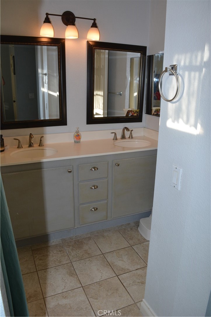 119 Draft Way Placentia, CA 92870 - Photo 12 of 24 a bathroom with a toilet sink and mirror