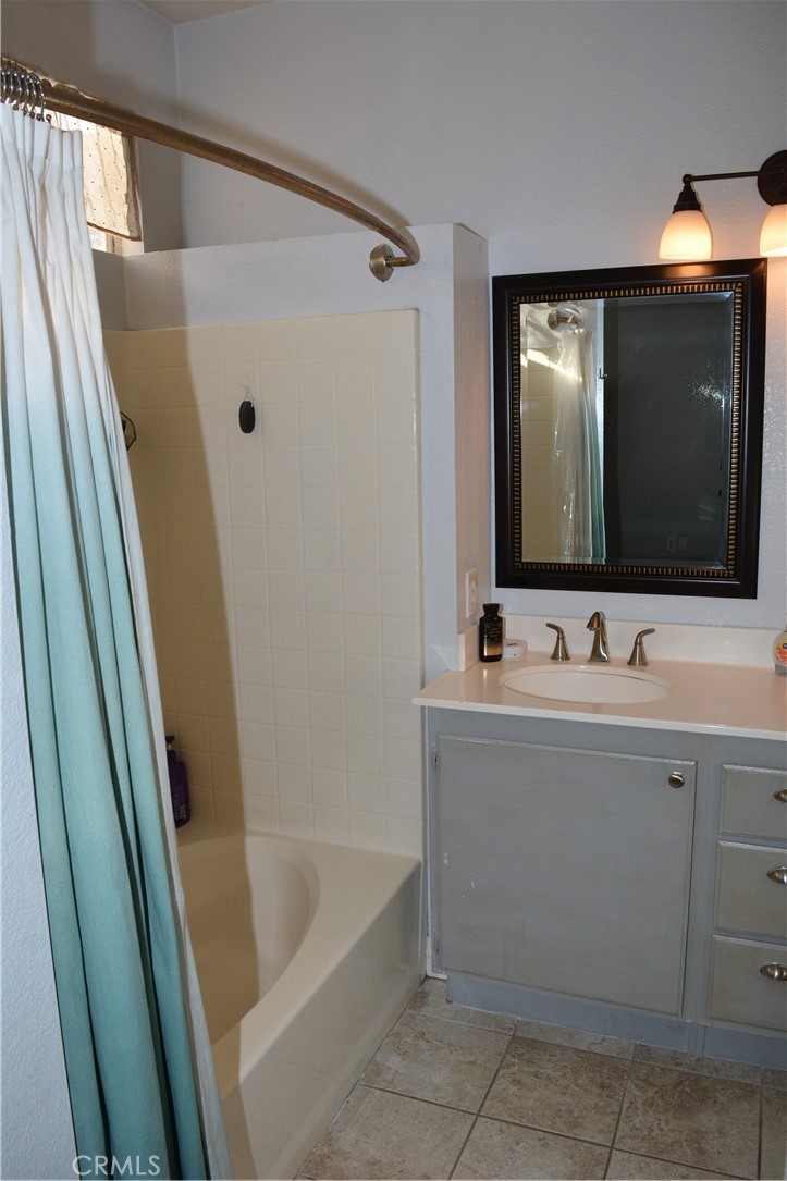 119 Draft Way Placentia, CA 92870 - Photo 13 of 24 a bathroom with a tub sink and mirror