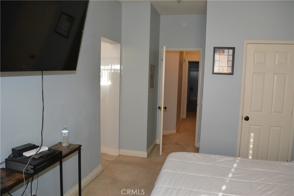 119 Draft Way Placentia, CA 92870 - Photo 14 of 24 a bedroom with a bed and a wall painting