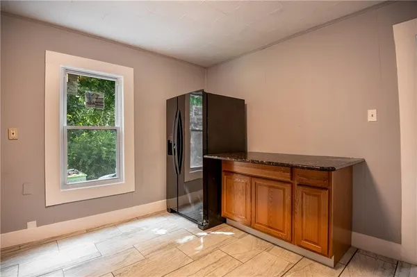 an empty room with windows and closet
