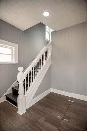 a view of an entryway with wooden floor