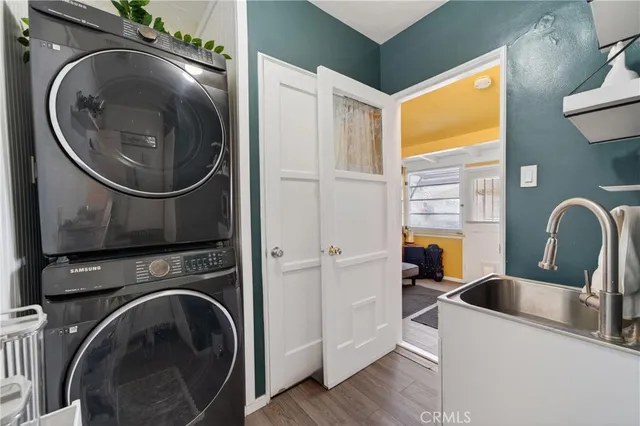 a view of a sink and washer and dryer