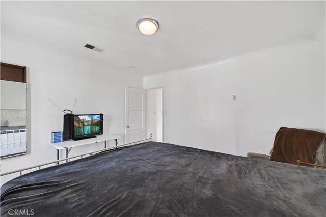 a living room with a flat screen tv
