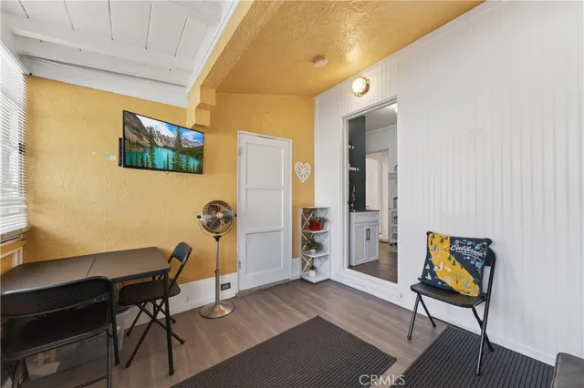 a workspace with furniture and wooden floor