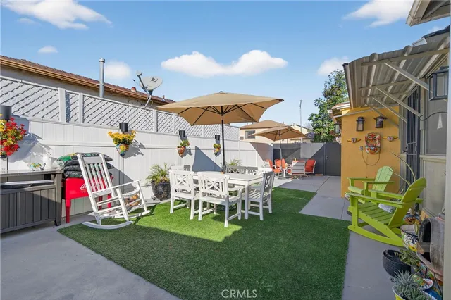 a view of a chairs and table in patio