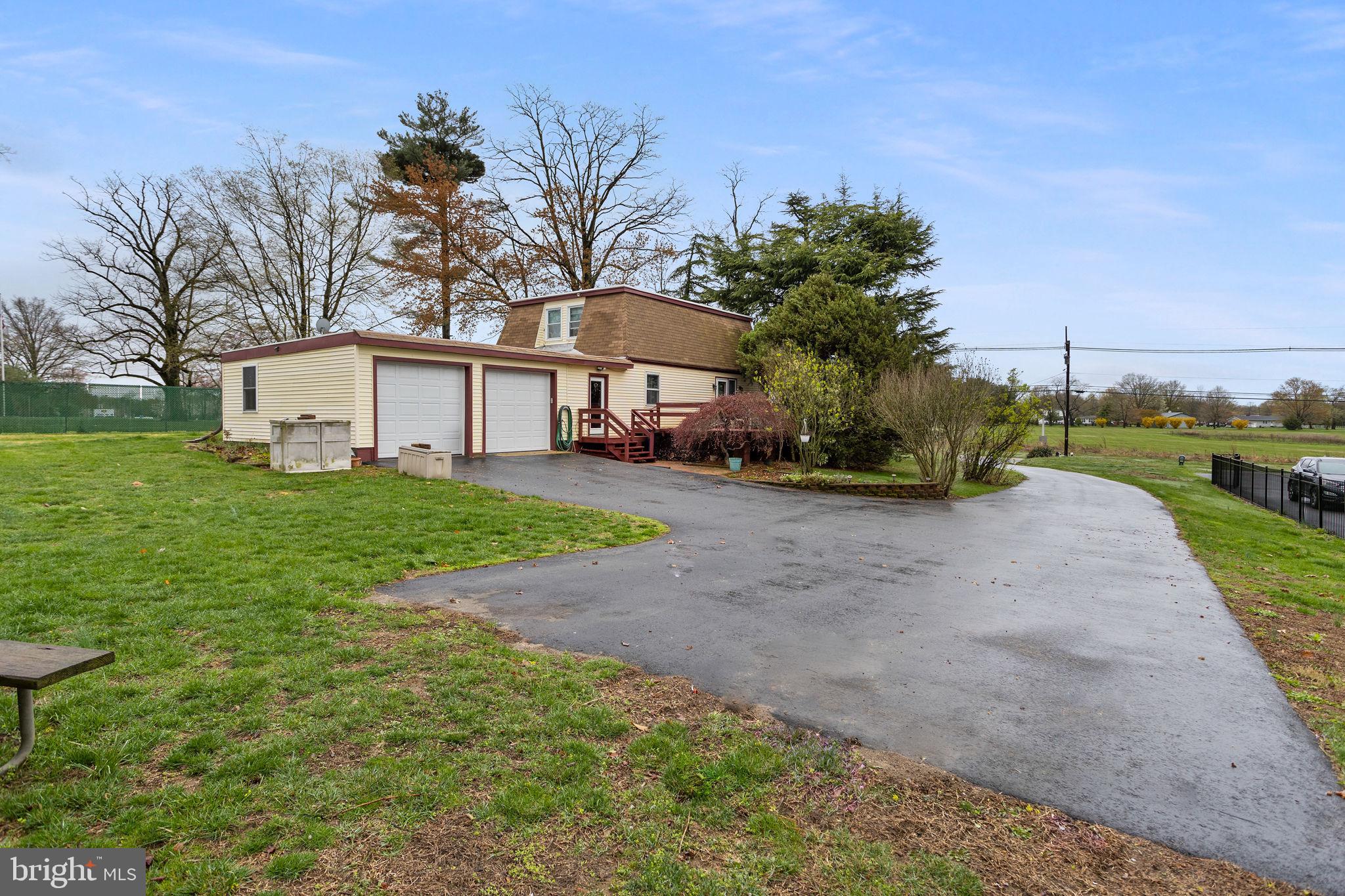 181 Crosswicks Chesterfield Road Chesterfield, NJ 08515 - Photo 2 of 32 a white house with a big yard and large trees