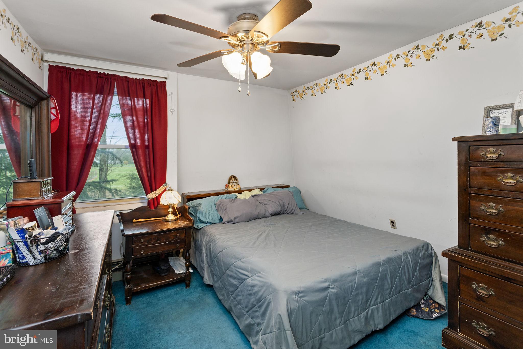 181 Crosswicks Chesterfield Road Chesterfield, NJ 08515 - Photo 22 of 32 a bedroom with a bed and a window
