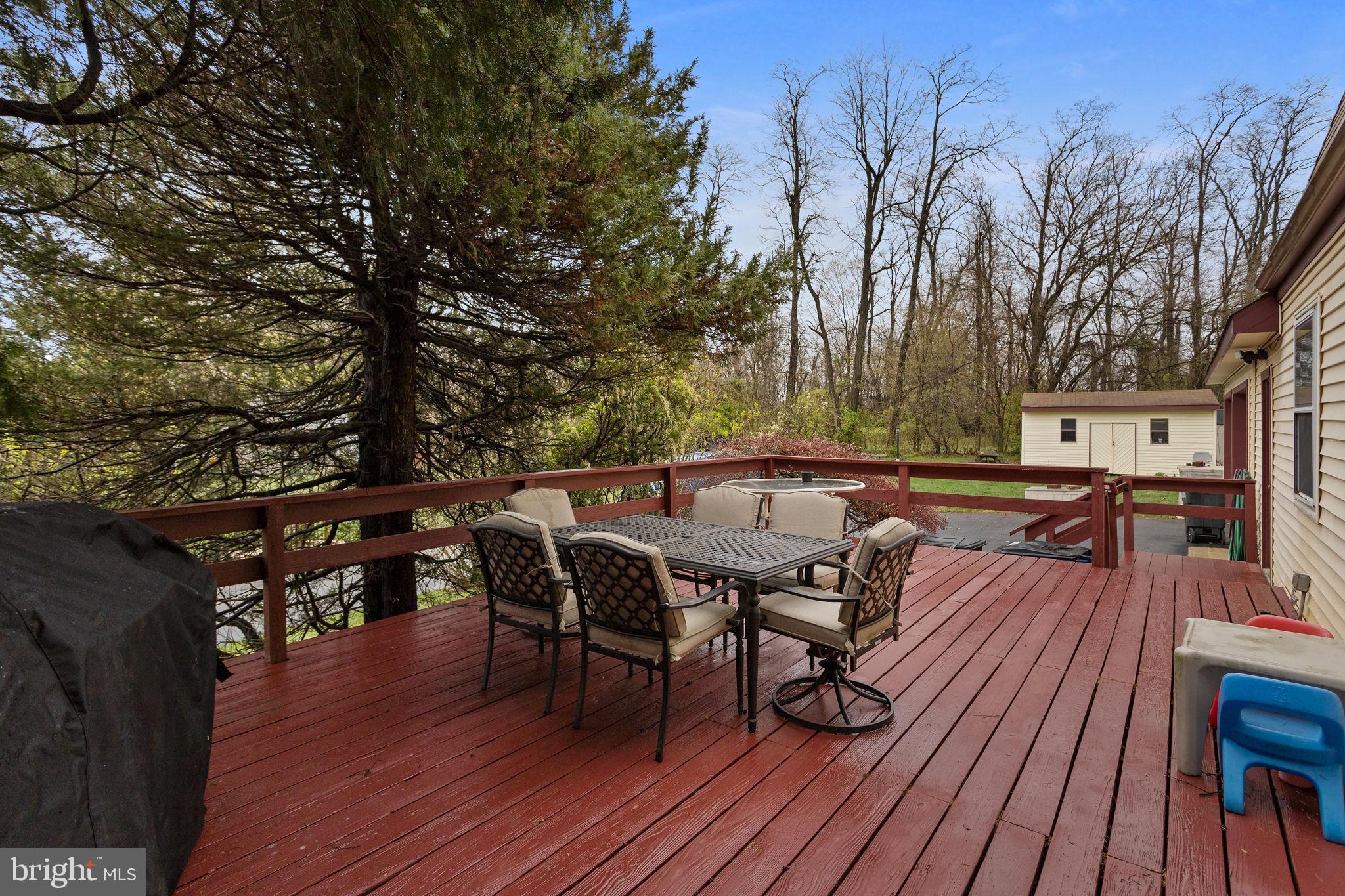 181 Crosswicks Chesterfield Road Chesterfield, NJ 08515 - Photo 27 of 32 a view of a patio with wooden floor and outdoor seating