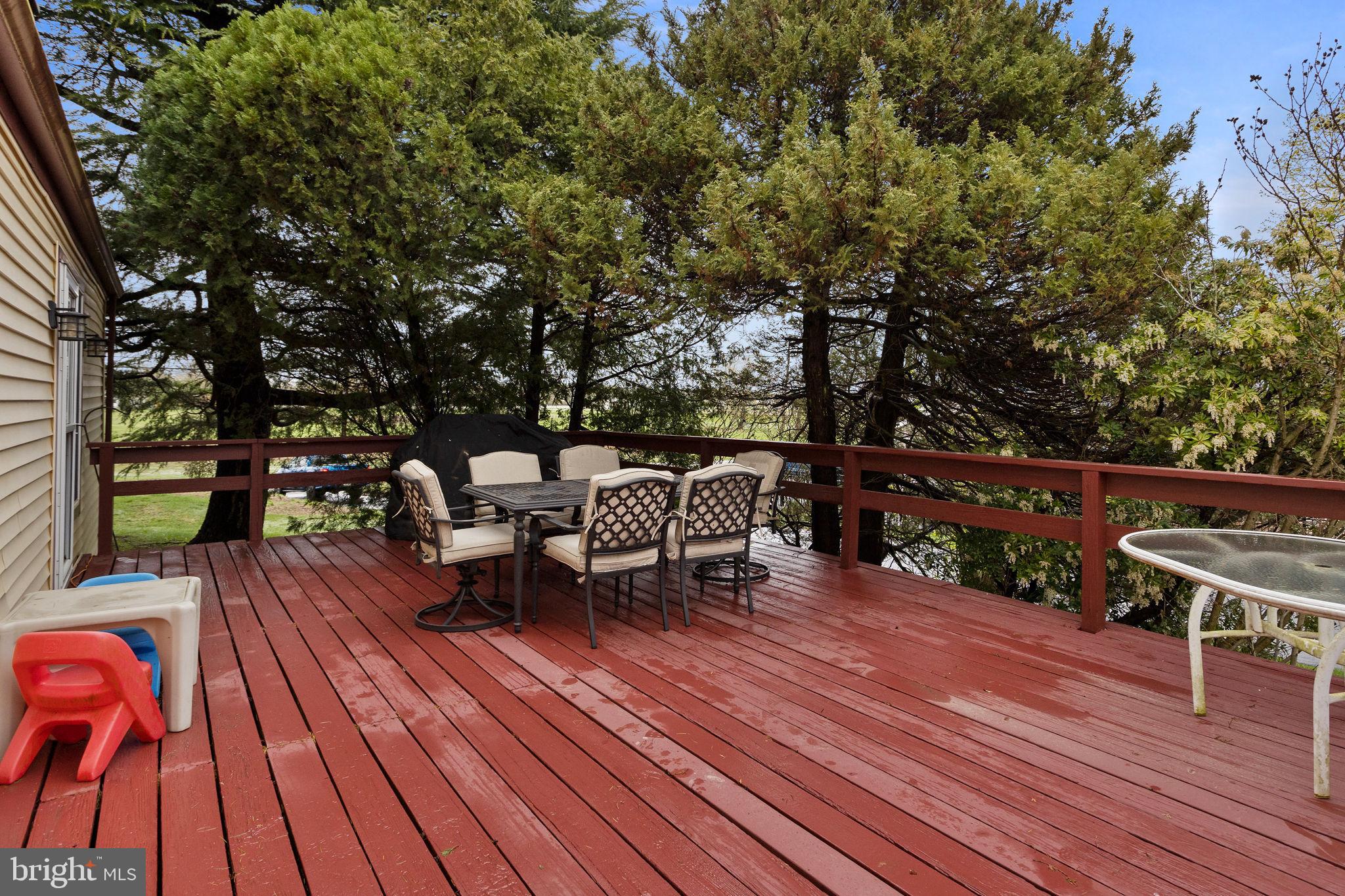 181 Crosswicks Chesterfield Road Chesterfield, NJ 08515 - Photo 28 of 32 a view of a deck with table and chairs a barbeque with wooden floor and fence