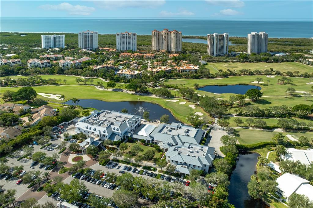 835 Tanbark Drive, Unit 203 Naples, FL 34108 - Photo 17 of 17 a view of a city with tall buildings