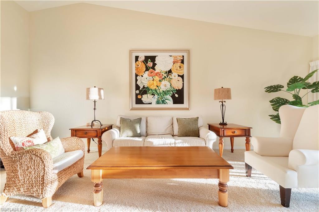 835 Tanbark Drive, Unit 203 Naples, FL 34108 - Photo 6 of 17 a bedroom with furniture and a potted plant