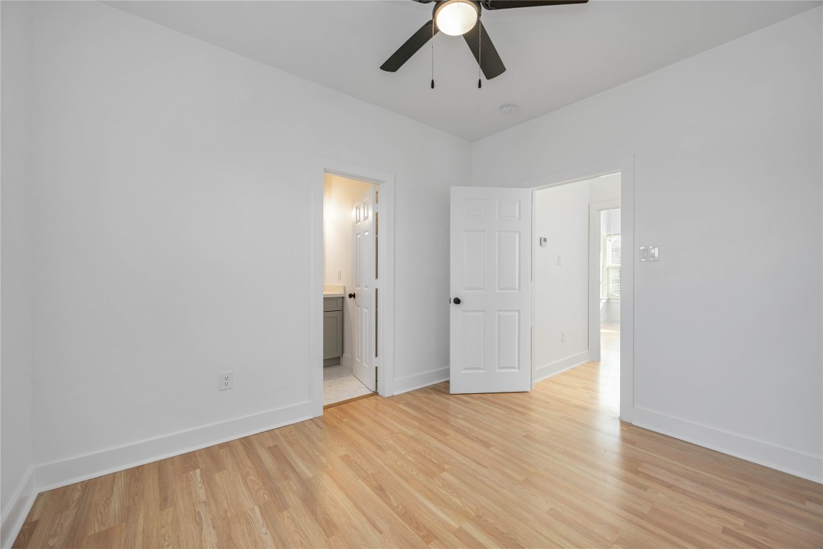 7710 Independence Street, Unit A Houston, TX 77051 - Photo 20 of 25 an empty room with wooden floor and windows