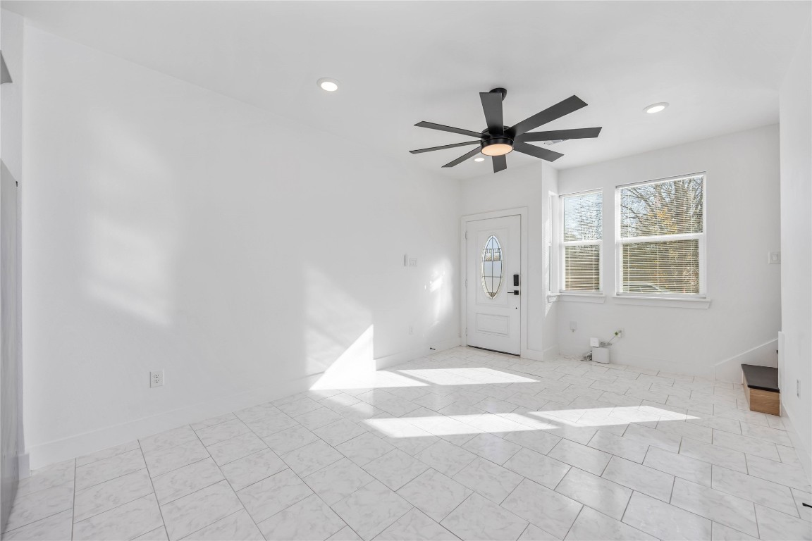 7710 Independence Street, Unit A Houston, TX 77051 - Photo 3 of 25 a view of a livingroom with a chandelier fan and windows