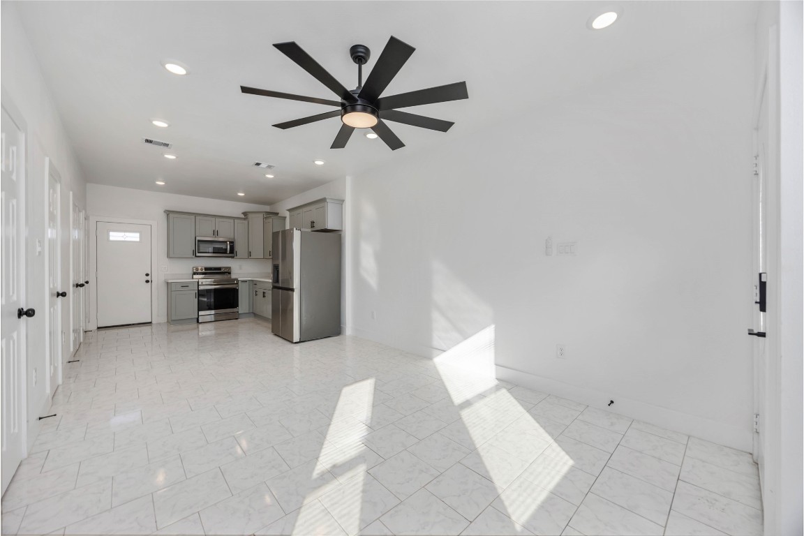 7710 Independence Street, Unit A Houston, TX 77051 - Photo 5 of 25 a living room with furniture and a ceiling fan