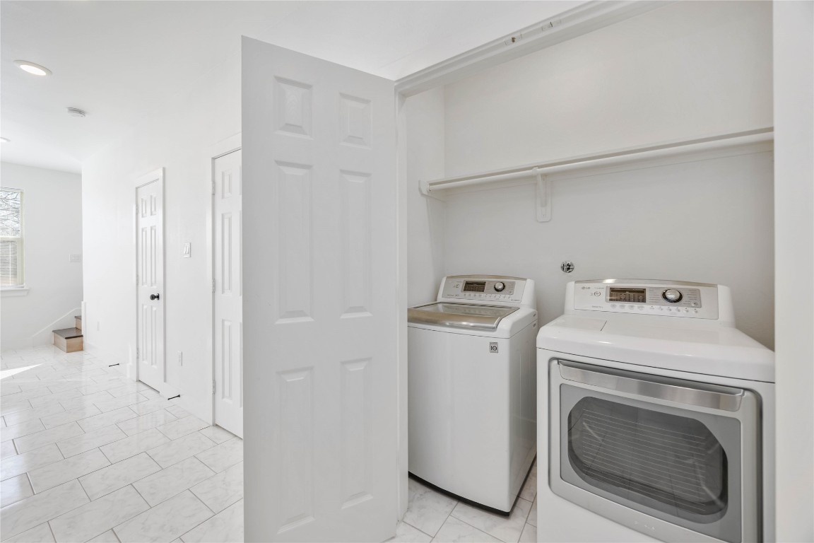 7710 Independence Street, Unit A Houston, TX 77051 - Photo 10 of 25 a utility room with dryer and washer