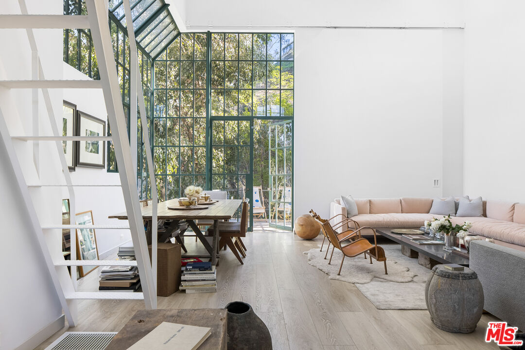2456 Astral Drive Los Angeles, CA 90046 - Photo 12 of 33 a living room with furniture and large windows