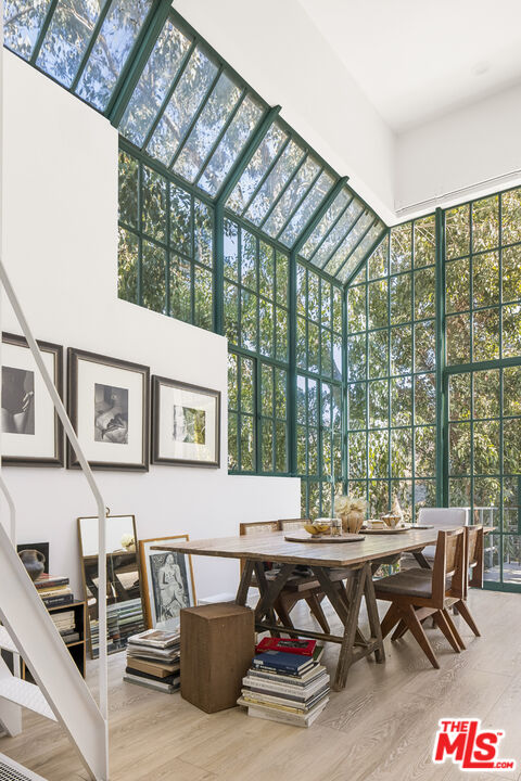 2456 Astral Drive Los Angeles, CA 90046 - Photo 14 of 33 a living room with furniture and a floor to ceiling window