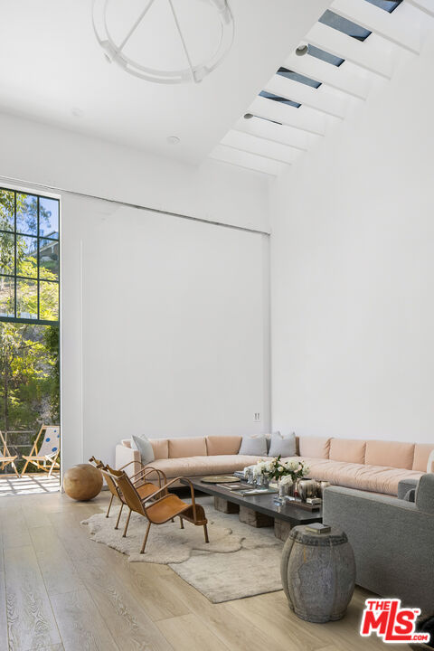 2456 Astral Drive Los Angeles, CA 90046 - Photo 17 of 33 a living room with furniture and floor to ceiling window