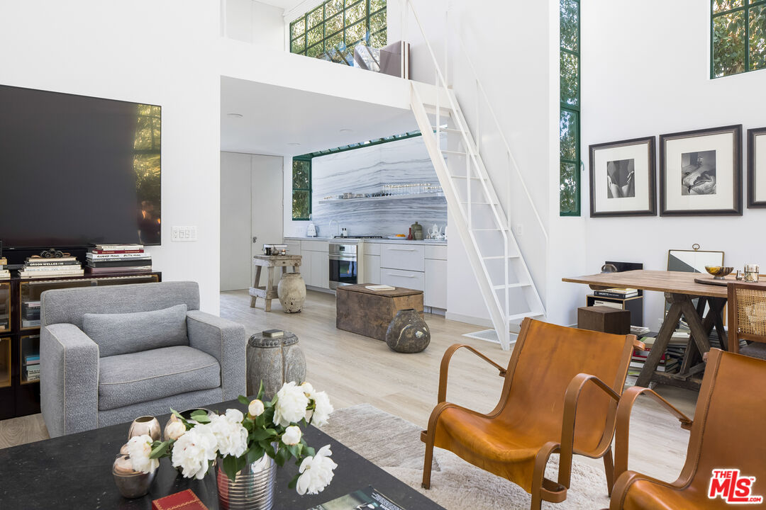 2456 Astral Drive Los Angeles, CA 90046 - Photo 20 of 33 a living room with furniture and wooden floor