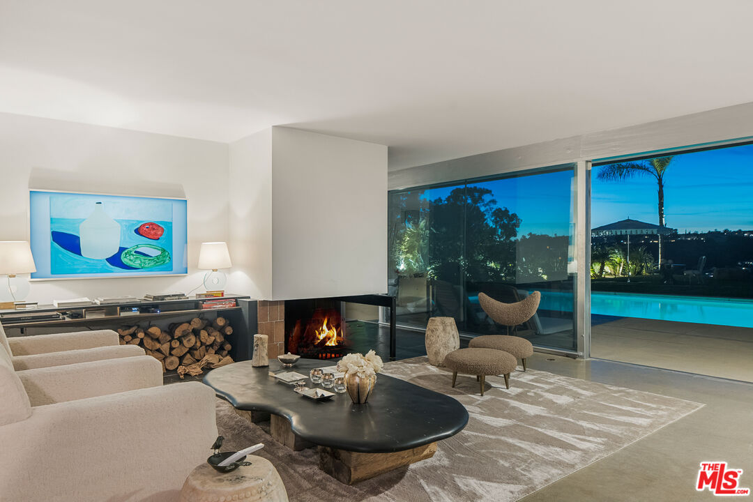 2456 Astral Drive Los Angeles, CA 90046 - Photo 29 of 33 a living room with furniture and a fireplace