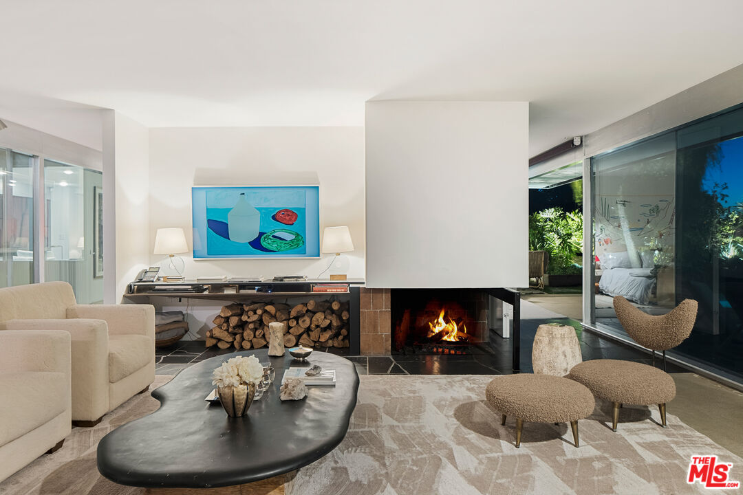 2456 Astral Drive Los Angeles, CA 90046 - Photo 30 of 33 a living room with furniture and a fireplace