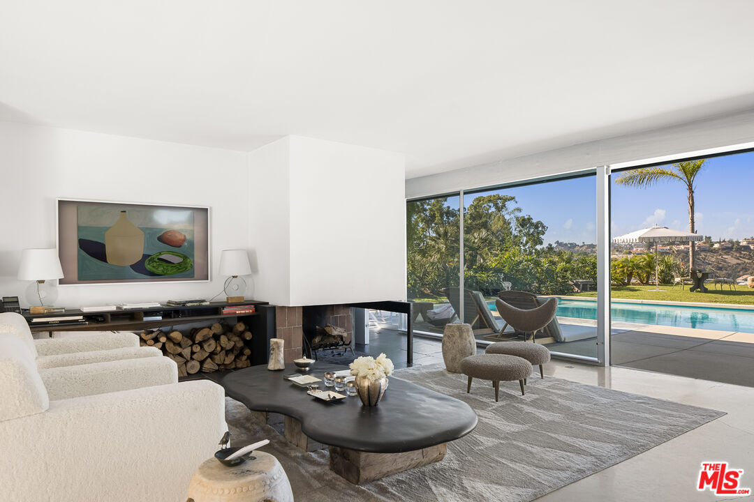 2456 Astral Drive Los Angeles, CA 90046 - Photo 6 of 33 a living room with furniture and a flat screen tv