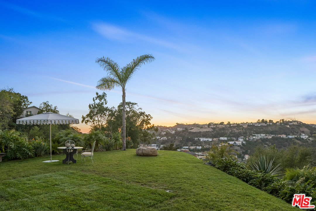 2456 Astral Drive Los Angeles, CA 90046 - Photo 9 of 33 a view of a garden with a building in the background