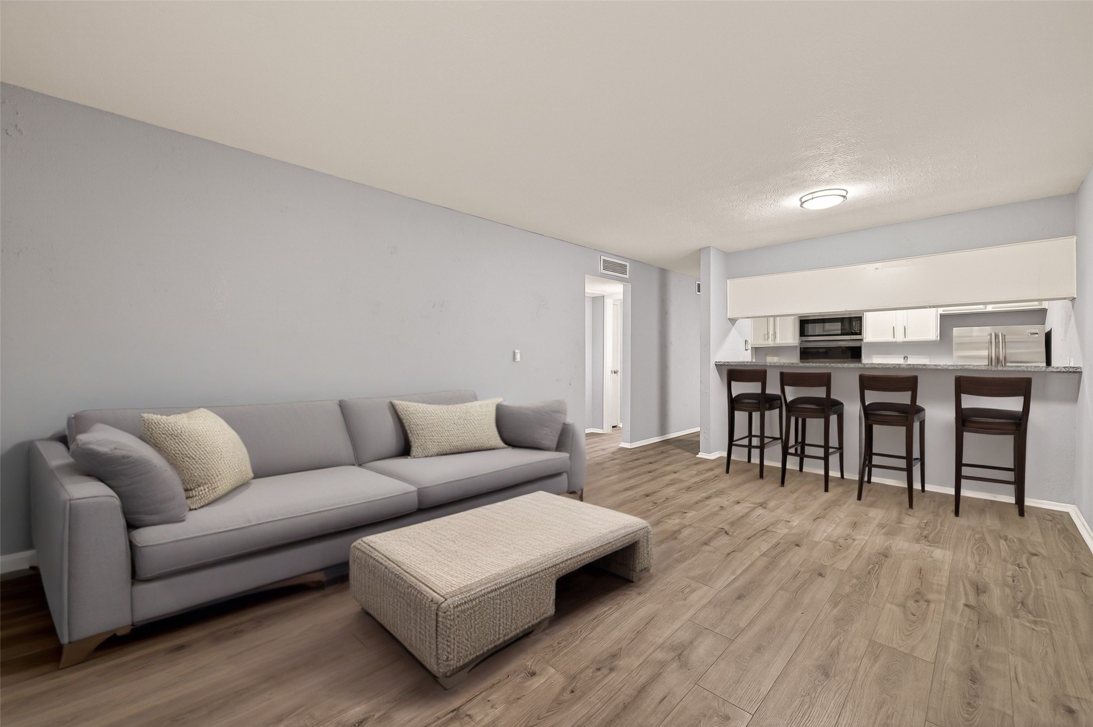 7313 Gulf Freeway, Unit 904 Houston, TX 77017 - Photo 1 of 27 a living room with furniture and wooden floor