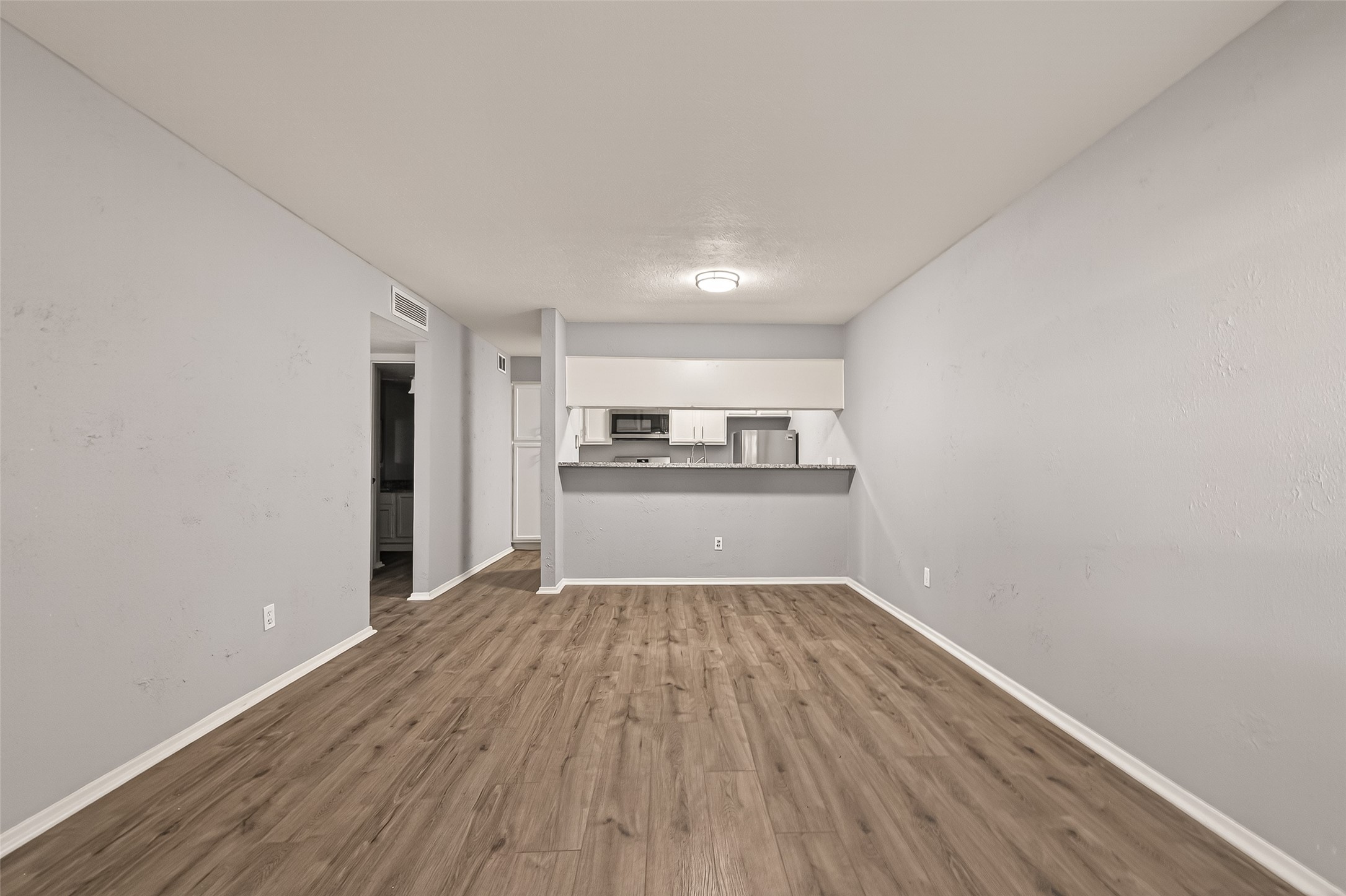 7313 Gulf Freeway, Unit 904 Houston, TX 77017 - Photo 12 of 27 a view of a kitchen with wooden floor