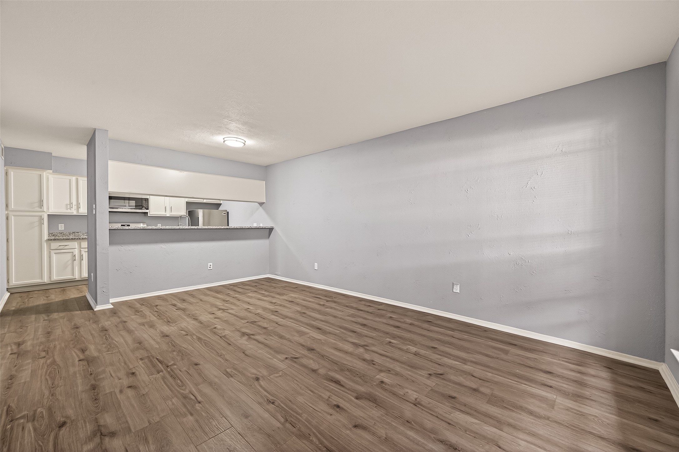 7313 Gulf Freeway, Unit 904 Houston, TX 77017 - Photo 4 of 27 a view of a kitchen with wooden floor