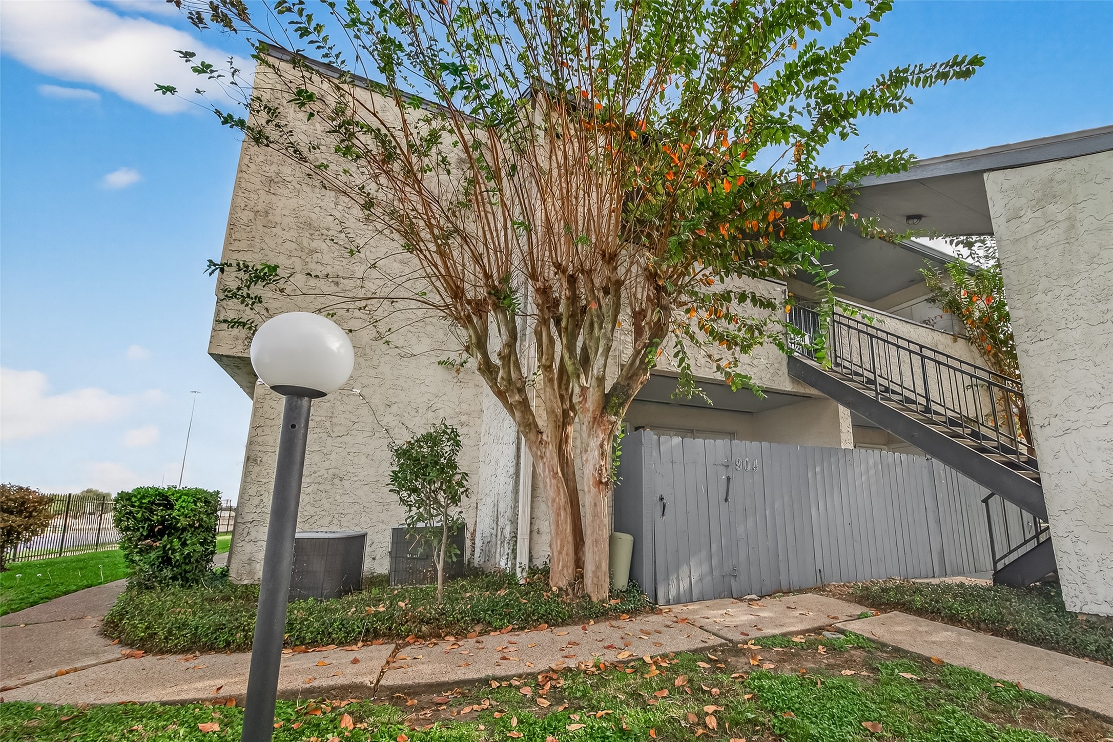 7313 Gulf Freeway, Unit 904 Houston, TX 77017 - Photo 8 of 27 a front view of a house with garden