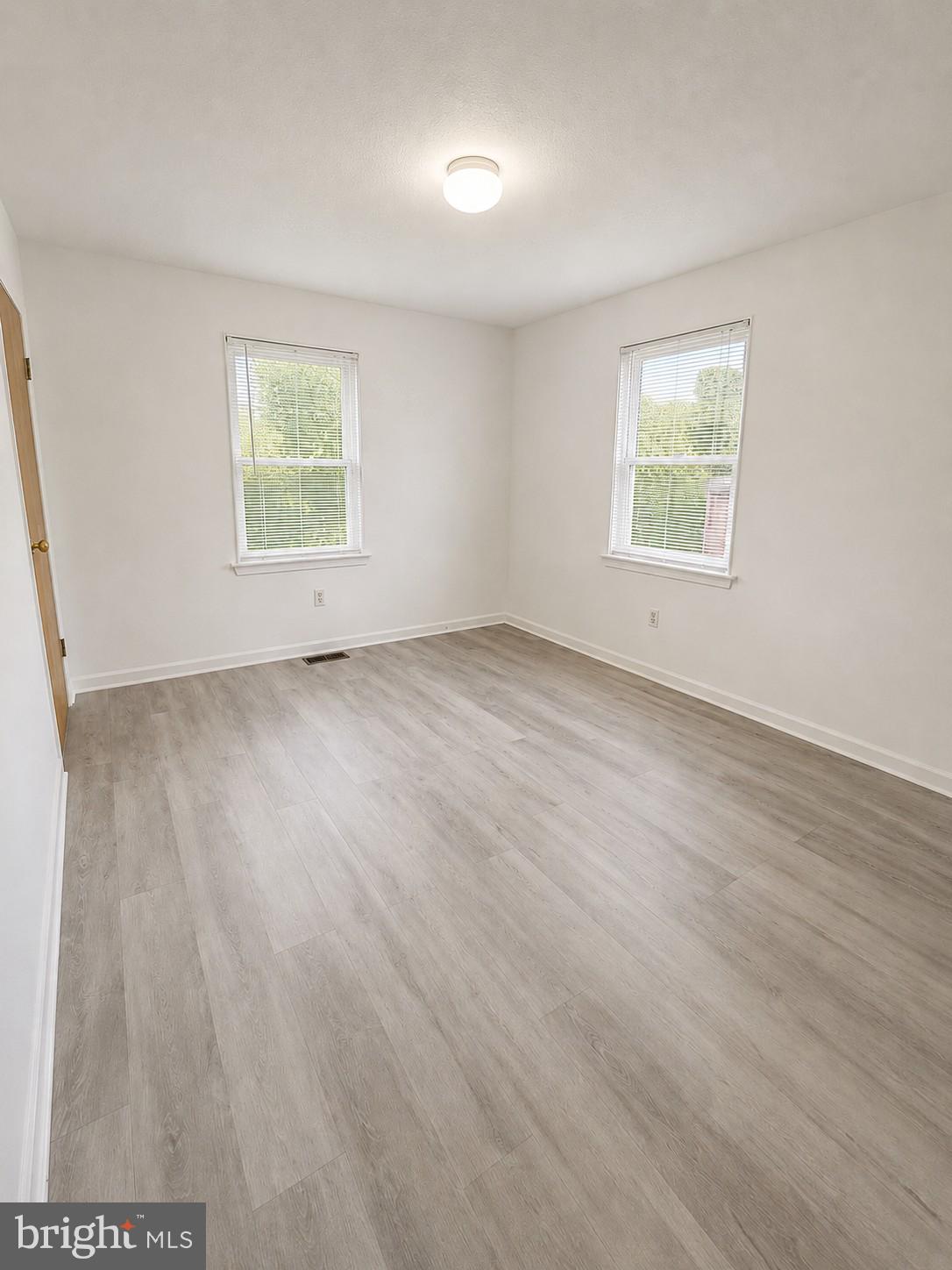 6204 Cipriano Road Lanham, MD 20706 - Photo 10 of 19 an empty room with a window