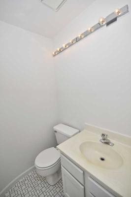 41 Bedford Road Mundelein, IL 60060 - Photo 15 of 16 a white toilet sitting next to a bathroom sink