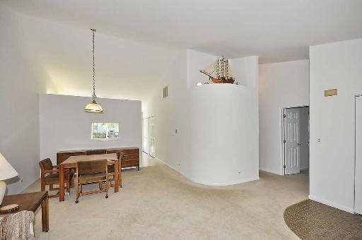 41 Bedford Road Mundelein, IL 60060 - Photo 5 of 16 a view of a room with furniture and a ceiling fan