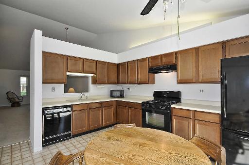 41 Bedford Road Mundelein, IL 60060 - Photo 6 of 16 a kitchen with a sink a stove and refrigerator
