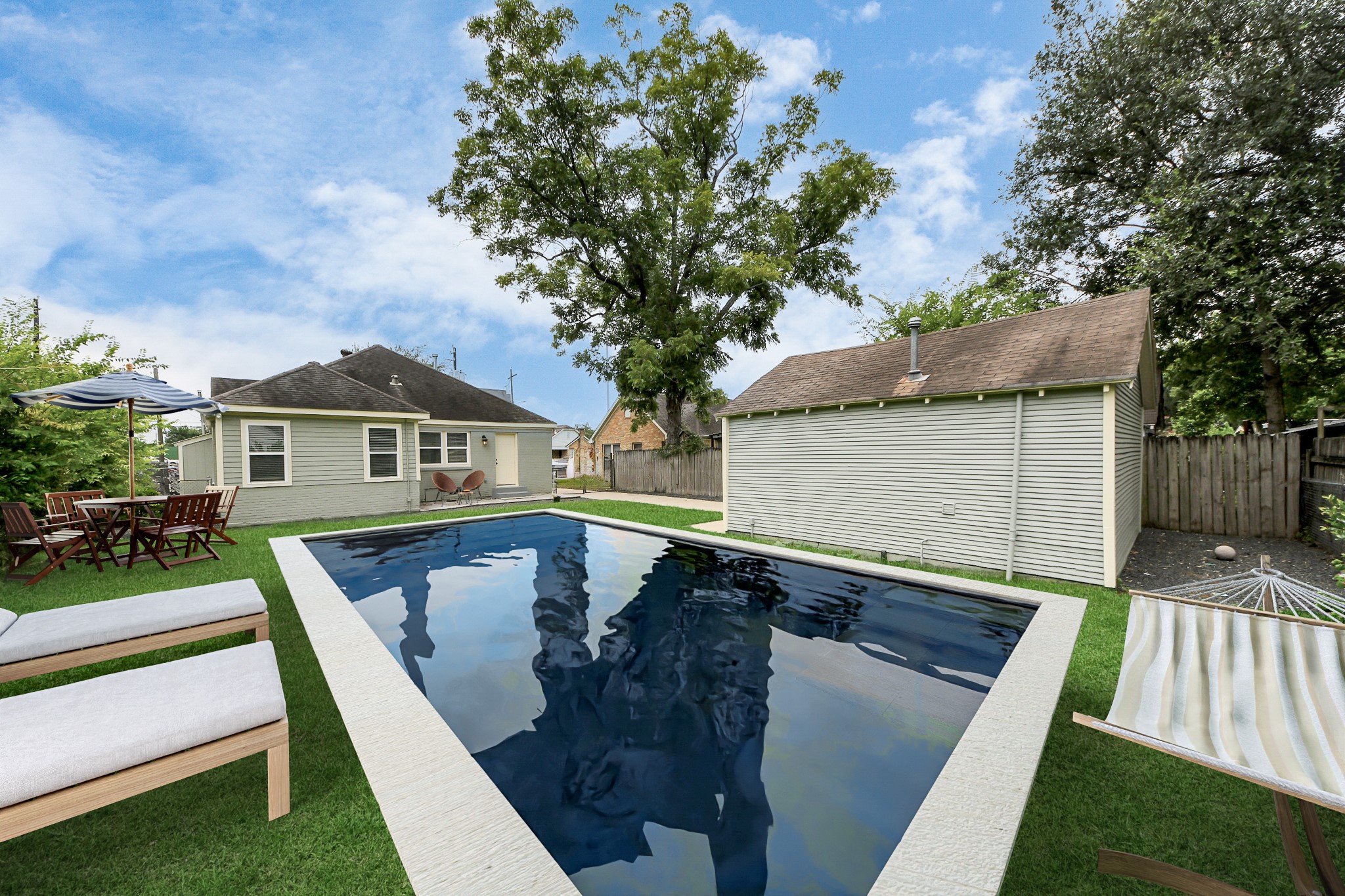 609 Reid Street Houston, TX 77022 - Photo 2 of 50 Lots of potential for this backyard. This beautiful pool is virtually staged.
