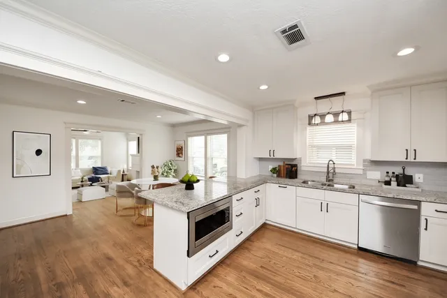 a bedroom with a large bed and white walls