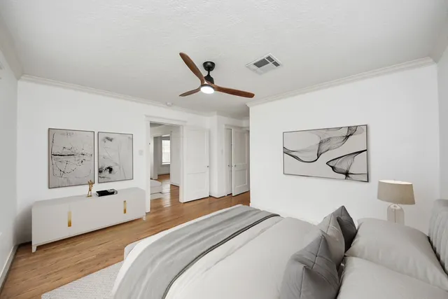 a bedroom with a bed and a couch