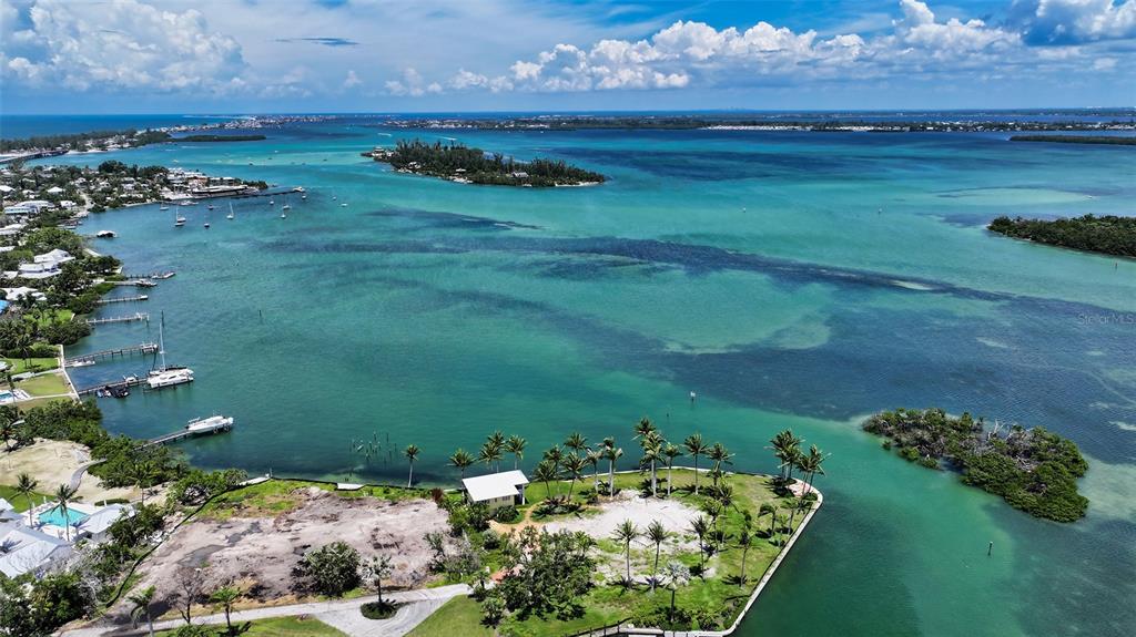 6516 Bayou Hammock Road Longboat Key, FL 34228 - Photo 11 of 20 a view of a lake with a big yard