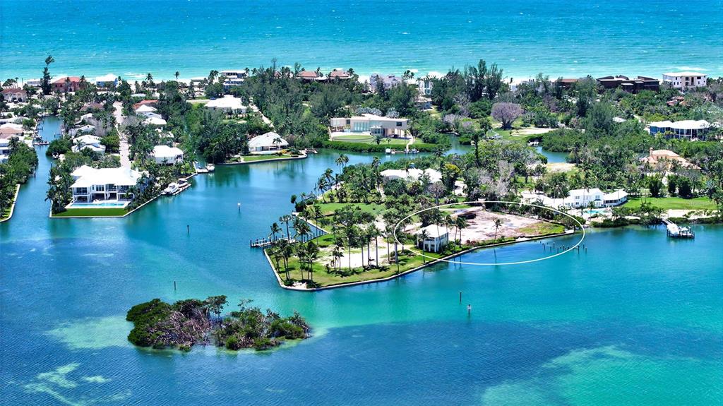 6516 Bayou Hammock Road Longboat Key, FL 34228 - Photo 13 of 20 a view of a lake with a city
