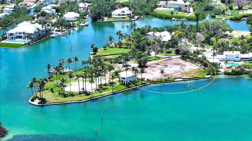 6516 Bayou Hammock Road Longboat Key, FL 34228 - Photo 15 of 20 a view of a lake with large trees