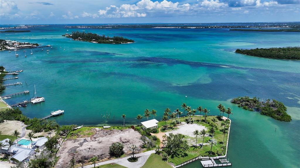 6516 Bayou Hammock Road Longboat Key, FL 34228 - Photo 20 of 20 a view of a lake with a yard